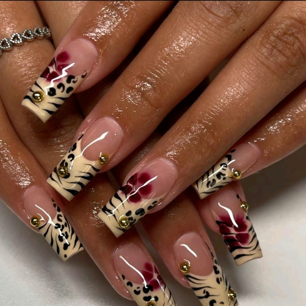 Elegant Animal Print Nail Art with Gold Accents
